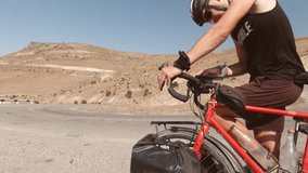 Cyclist checking offline maps navigation on smartphone attached to red bicycle while touring, concept of route planning, decision-making, resilience, solitude, freedom, exploring unknown landscapes - Powered by Shutterstock - Get 15% off with code: PIKWIZARD15