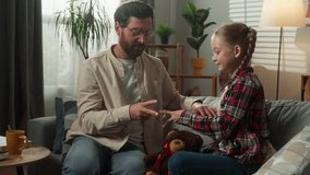 Family at home father and daughter kid child girl playing with hands rock paper scissors game showing signs fingers spending time together bonding dad winning happy cozy parenting childhood indoors - Powered by Shutterstock - Get 15% off with code: PIKWIZARD15