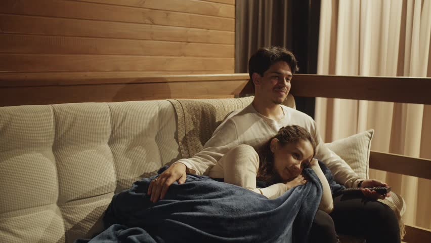 Couple Having Fun Watching Movie 
Couple Reacting to Scary Movie
Funny Couple Watching Horror Film
