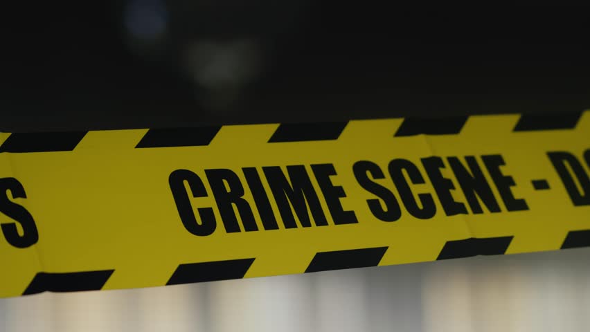 Intermittent Flash light illuminates Police Crime scene reflective tape