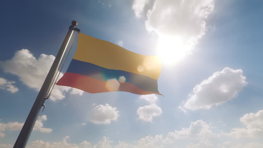 Colombia Flag waving on a Flagpole with a cloudy blue sky background