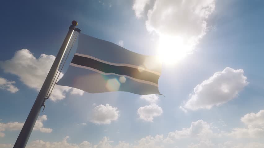 Botswana Flag waving on a Flagpole with a cloudy blue sky background