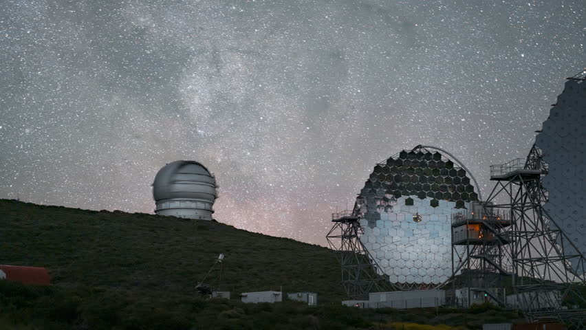 Majestic view of telescopes at Roque de los Muchachos Observatory under a starry sky, timelapse
