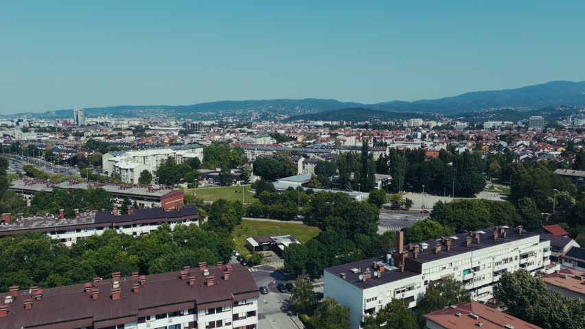 cityscape of Zagreb framed by distant hills and bright summer skies