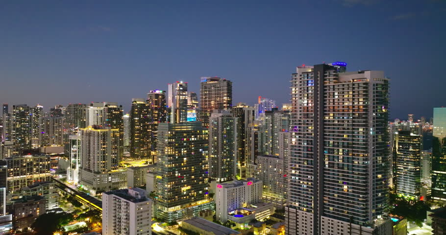 View from above of skyscraper buildings in downtown district of Miami, Florida, USA. American city with business financial district at night.