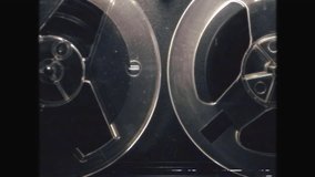 Vintage Reel-to-Reel Tape with Retro VHS Effect - Nostalgic 70s 80s Audio Recording and Film, Classic Analog Technology, Grainy Video Style, Old School Cinema and Sound Equipment Aesthetic - Powered by Shutterstock - Get 15% off with code: PIKWIZARD15