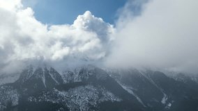 Aerial hyper lapse of snowy mountains landscape with clouds motion fast. - Powered by Shutterstock - Get 15% off with code: PIKWIZARD15