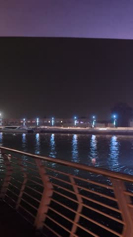 night view of dubai in the united arab emirates. Downtown, waterfall, river, gulf, skyscrapers of the business center in the evening. Islamic culture and travel