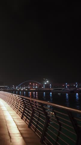 night view of dubai in the united arab emirates. Downtown, waterfall, river, gulf, skyscrapers of the business center in the evening. Islamic culture and travel