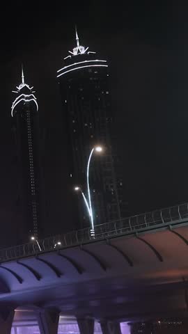 night view of dubai in the united arab emirates. Downtown, waterfall, river, gulf, skyscrapers of the business center in the evening. Islamic culture and travel