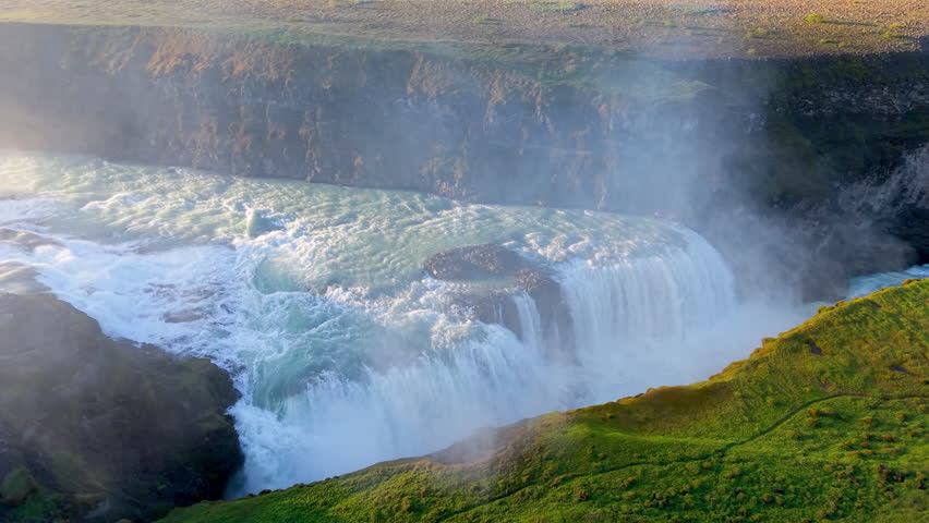 Aerial Views of a Majestic Waterfall Gullfoss Accompanied by a Rainbow. Iceland