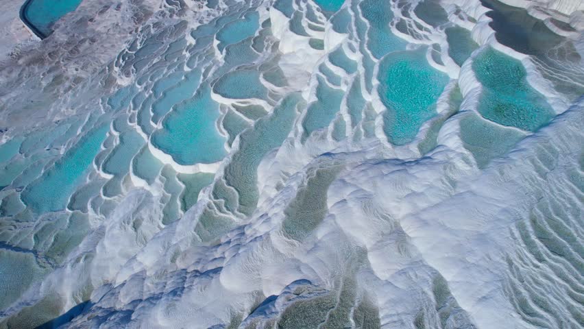 Aerial view Natural travertine pools Pamukkale Turkish, spa terraces with blue water.