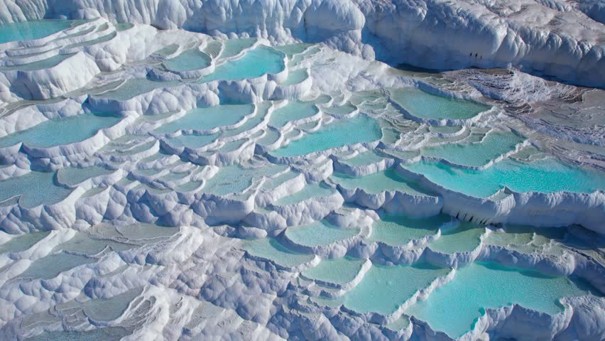Aerial view Pamukkale nature terraces travertine pools with blue water, Denizli landmark of Turkey.