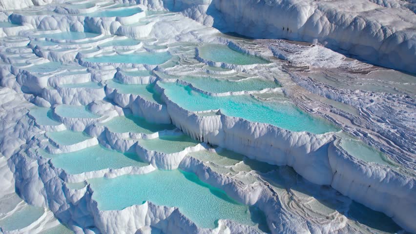 Aerial view Natural travertine pools Pamukkale Turkish, spa terraces with blue water.