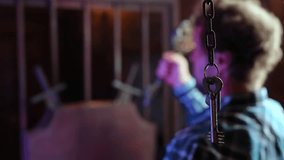 Man opens a closed door to the quest room with a large key - Powered by Shutterstock - Get 15% off with code: PIKWIZARD15