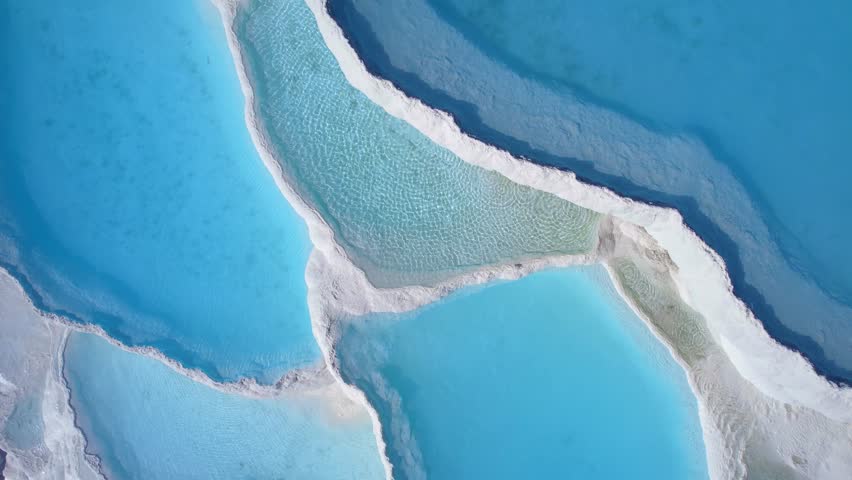 Aerial view Natural travertine pools Pamukkale Turkish, spa terraces with blue water.