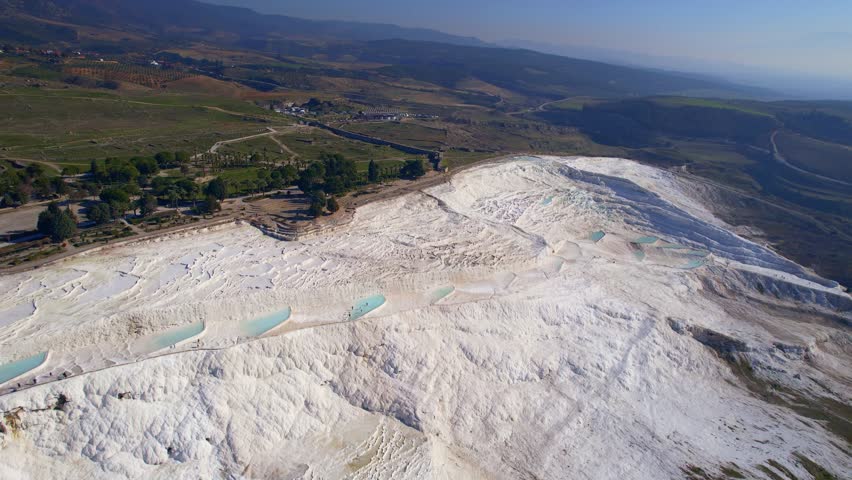 Aerial view Natural travertine pools Pamukkale Turkish, spa terraces with blue water.