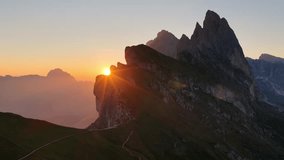 sunrise in the Dolomites in Italy, hiking in Italian Alps, travel in Italian Dolomites, drone shot of Seceda mountain peak in Puez Odle natural park in the Dolomites.  - Powered by Shutterstock - Get 15% off with code: PIKWIZARD15