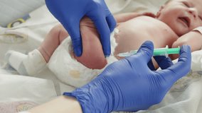 A newborn baby receives an injection from a medical professional in a hospital setting. The focus is on the vaccination process. - Powered by Shutterstock - Get 15% off with code: PIKWIZARD15