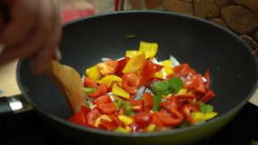 Bell peppers and onions being stir-fried in a wok - Powered by Shutterstock - Get 15% off with code: PIKWIZARD15
