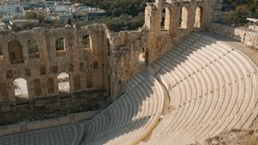 Odeon of Herodes Atticus stone Roman theatre on Acropolis of Athens, Greece. Ancient Greek architecture. Popular travel and touristic landmark - Powered by Shutterstock - Get 15% off with code: PIKWIZARD15