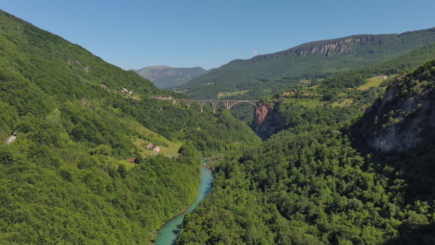 Aerial view on Djurdjevica arch bridge over the Tara River canyon in northern Montenegro, 4k