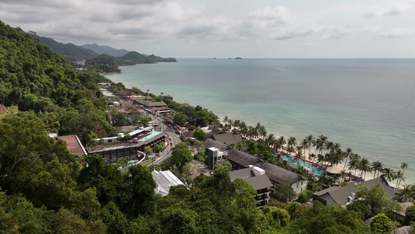 A stunning aerial view of a beach and mountain landscape in Thailand