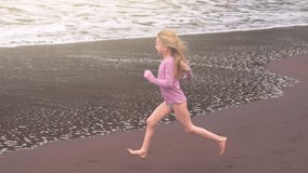 Joyful child running through shallow waves at the beach on a sunny summer day filled with laughter and freedom - Powered by Shutterstock - Get 15% off with code: PIKWIZARD15