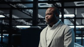 Admin working in high tech server hub capable of processing and storing vast amounts of data. African american IT specialist troubleshooting server rows controlling network resources, camera B - Powered by Shutterstock - Get 15% off with code: PIKWIZARD15