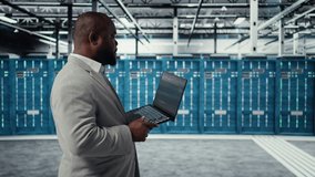 Data center developer writing code for resource optimization using notebook. Server room engineer deploying new builds to improve uptime using software on laptop, camera A - Powered by Shutterstock - Get 15% off with code: PIKWIZARD15