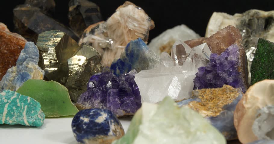 Natural Semi Precious stones and minerals, riches of Earth. Green garnet, purple Amethysts, Quartz crystals, blue Lazurite, green Nephrite and Amazon stone, yellow Citrine, Barite and golden Pyrite