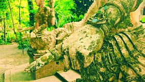 Art Series - A ancient aculpture of guardian angel in the middle of the forest at Wat Pha Lat. Buddhist Art in Forest Monastery. Ancient statues according to Buddhist beliefs, Thailand. - Powered by Shutterstock - Get 15% off with code: PIKWIZARD15