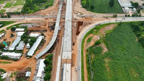 Drone shot of highway and overpass construction site with vehicles and road for infrastructure civil industry engineering and transportation concept - Powered by Shutterstock - Get 15% off with code: PIKWIZARD15