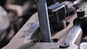 The mechanic replacing spark plugs for gasoline engines that are old and have expired will cause incomplete combustion in the engine, in soot and dirt. Changing spark plugs - Powered by Shutterstock - Get 15% off with code: PIKWIZARD15