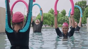 Group Asian Geriatric exercise before Aquatic therapy in swimming pools or hydrotherapy pools by coach Physiotherapist.Elderly hydrotherapy,physiological wellness,Balance training,health care concept - Powered by Shutterstock - Get 15% off with code: PIKWIZARD15
