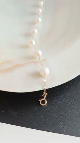 Elegant White Pearl Bracelet on Classy Plate Background
