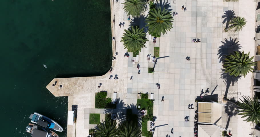 Split Riva - Overhead View Of People Walking In The Promenade Of Split Old Town In Croatia. - aerial shot
