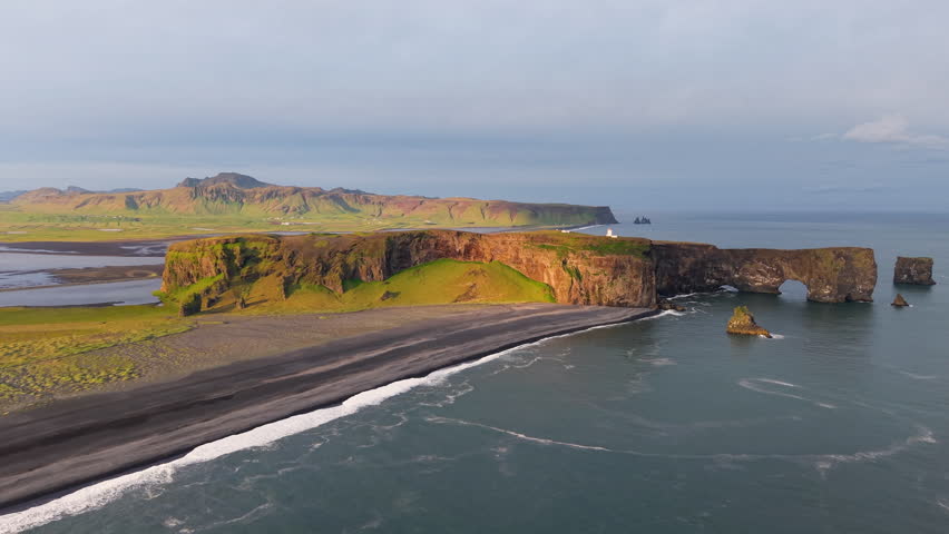 Discover Icelands stunning coast, famous for its unique and breathtaking rock formations. Dyrholay