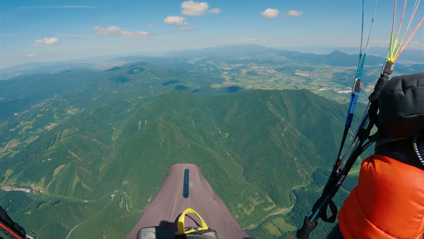 Paragliding POV Flying High above Green Forest Mountains, Pilot Cockpit View, Adrenaline Adventure