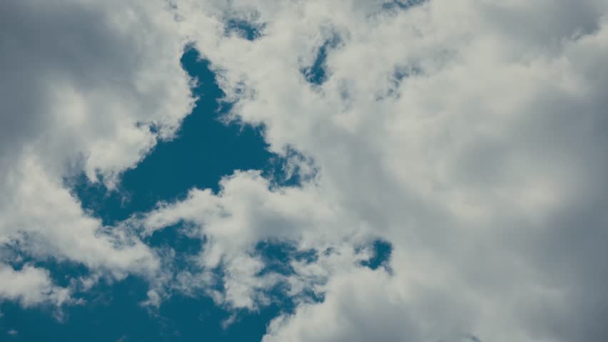 Thick Clouds Passing Against Blue Sky. Timelapse