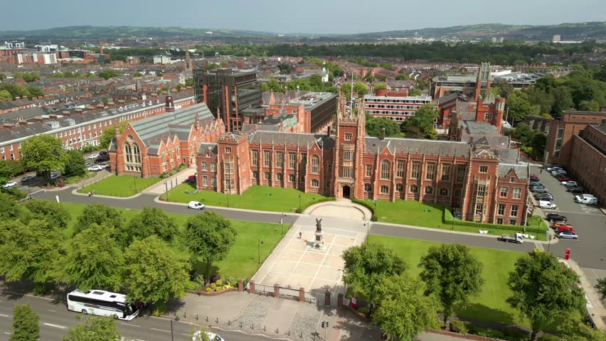 Wide, forward travelling aerial video of the campus at Queen