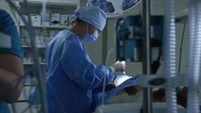 Female veterinarian surgeon performing operation on patient in an healthcare animal clinic operating room, side view. Veterinary medicine concept. - Powered by Shutterstock - Get 15% off with code: PIKWIZARD15