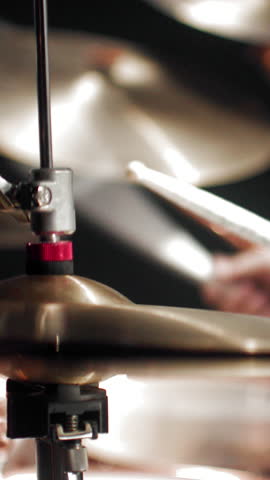Professional drum set, details view during gig of rock band, closeup view of hammer striking drum. Feel rhythm and emotions of modern music, rehearsal of musical group in garage, underground style