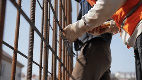 Workers tying rebar at construction site - Powered by Shutterstock - Get 15% off with code: PIKWIZARD15