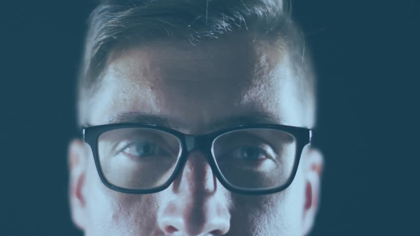 Developer wearing glasses initiating waveform, visualizing brain overlay with drifting particles. Technology, neuroscience, innovation, futurism, digital, data, analytics