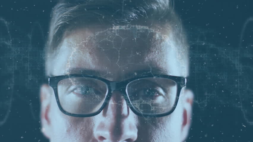 Developer wearing glasses initiating waveform, visualizing brain overlay with drifting particles. Technology, neuroscience, innovation, futurism, digital, data, analytics
