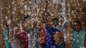 Confetti fading revealing teenage boy lifting basketball trophy while team cheering celebrating win. Victory, teamwork, achievement, sportsmanship, celebration, camaraderie, vibrant - Powered by Shutterstock - Get 15% off with code: PIKWIZARD15
