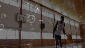 Sports athlete entering court holding ball, dribbling toward hoop speeding jumping dunking to score. Athlete, sports, intensity, motion, arena, training, determination - Powered by Shutterstock - Get 15% off with code: PIKWIZARD15