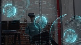 Tech professional donning VR headset and manipulating wireframe globe for data analysis in office. Virtual reality, hologram, data visualization, immersive technology, futuristic, collaboration, - Powered by Shutterstock - Get 15% off with code: PIKWIZARD15