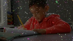 Boy opening spiral-bound notebook and lifting yellow pencil, practicing writing for education. Education, student, classroom, learning, creativity, focus, academic - Powered by Shutterstock - Get 15% off with code: PIKWIZARD15